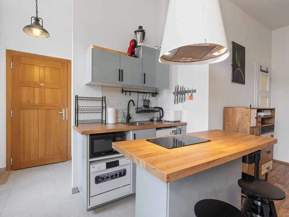 Furniture, Kitchen, Countertop, Kitchen Appliance, Cabinetry, Interior Design, Flooring, Wood, Major Appliance, Floor