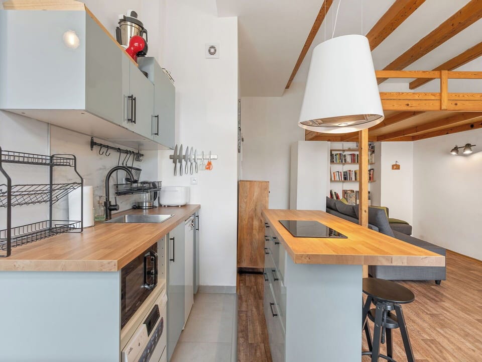 Furniture, Kitchen, Countertop, Interior Design, Flooring, Cabinetry, Kitchen Appliance, Wood, Floor, Light Fixture