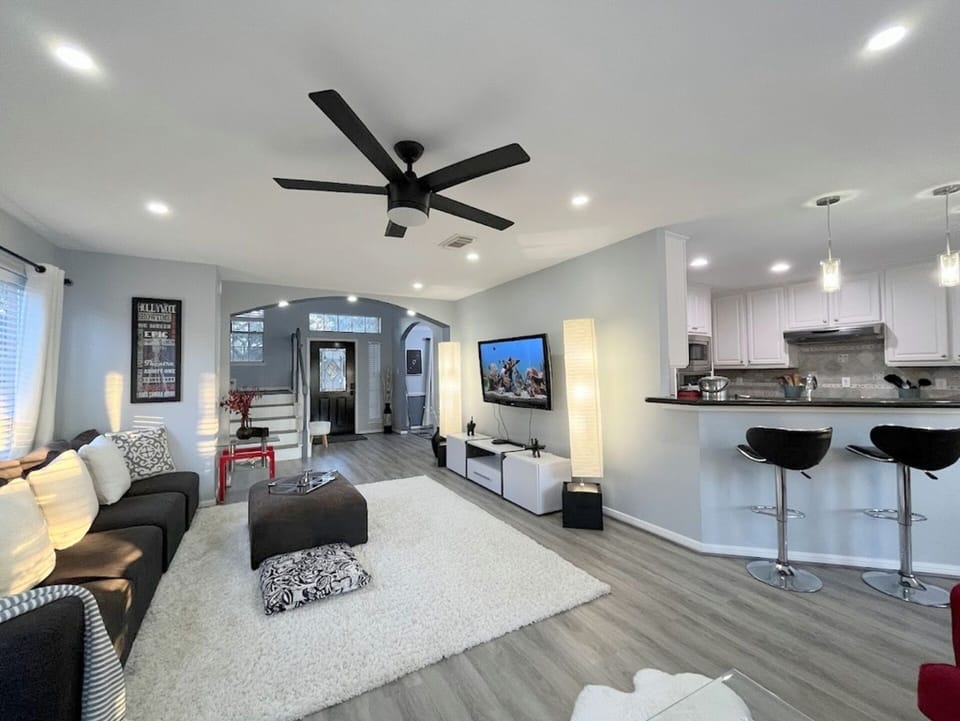 Step through a bright, open layout linking the cozy living room and sleek kitchen.