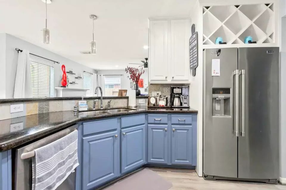 Prepare meals effortlessly in a kitchen with modern appliances and abundant counters.