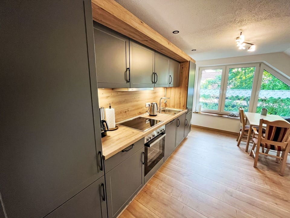 Countertop, Flooring, Kitchen, Interior Design, Furniture, Wood, Floor, Cabinetry, Ceiling, Wood Flooring