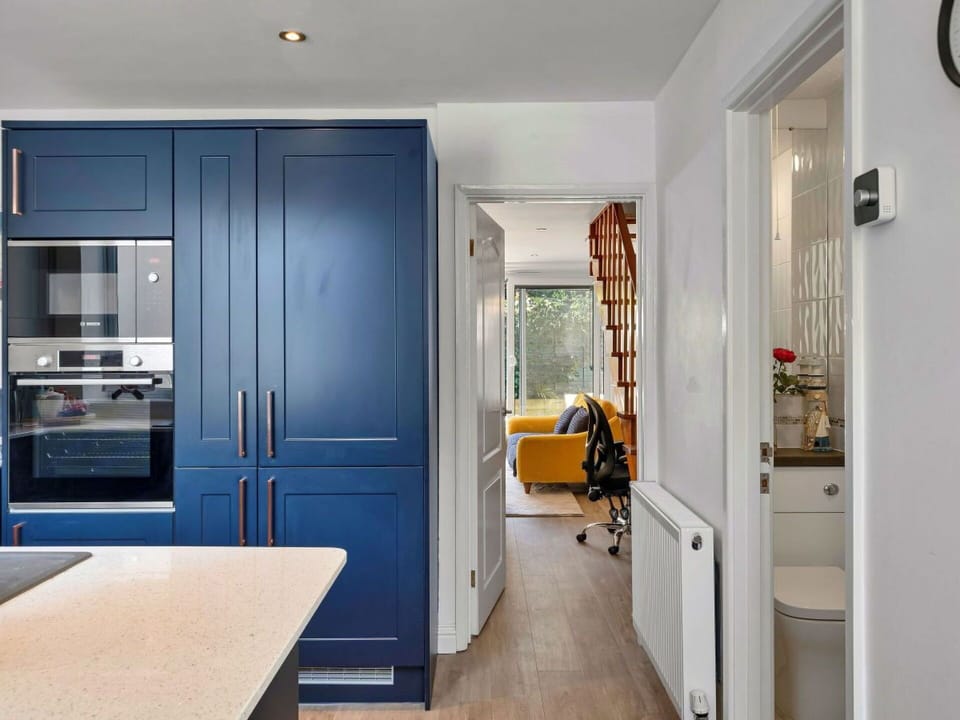 Furniture, Interior Design, Flooring, Cabinetry, Countertop, Wood, Floor, Kitchen Appliance, Kitchen, Ceiling