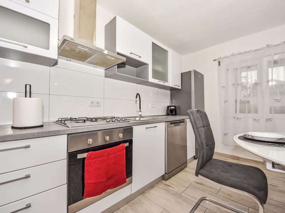 Furniture, Kitchen, Flooring, Countertop, Major Appliance, Interior Design, Kitchen Appliance, Wood, Cabinetry, Floor