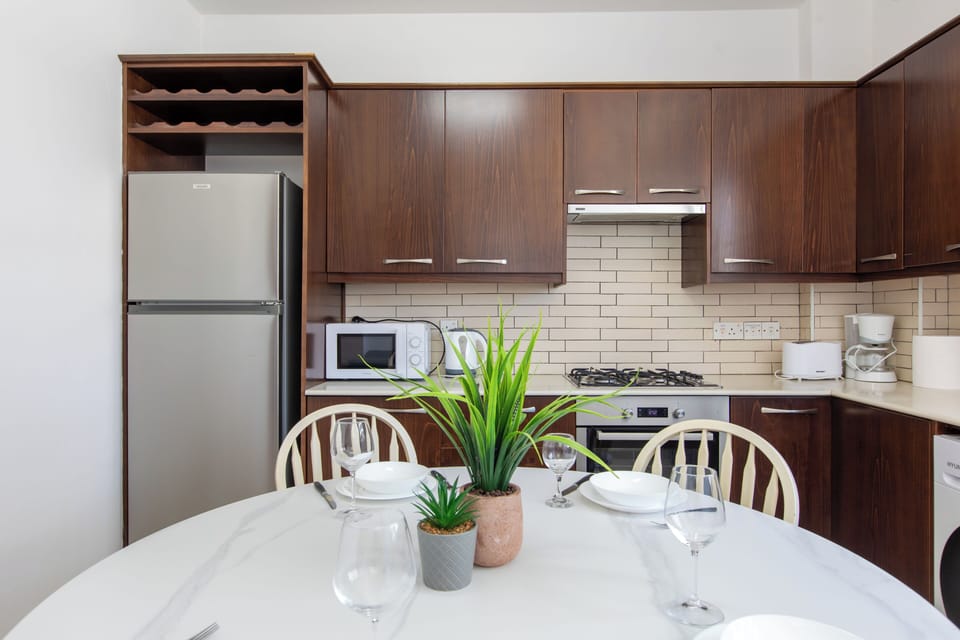 Apartment, 2 Bedrooms, City View | Private kitchen | Coffee/tea maker, full-size fridge, microwave, oven