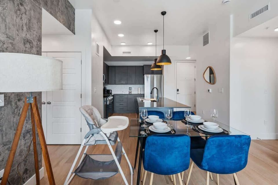 Dine in comfort at a chic four-person dining area just steps from the kitchen.