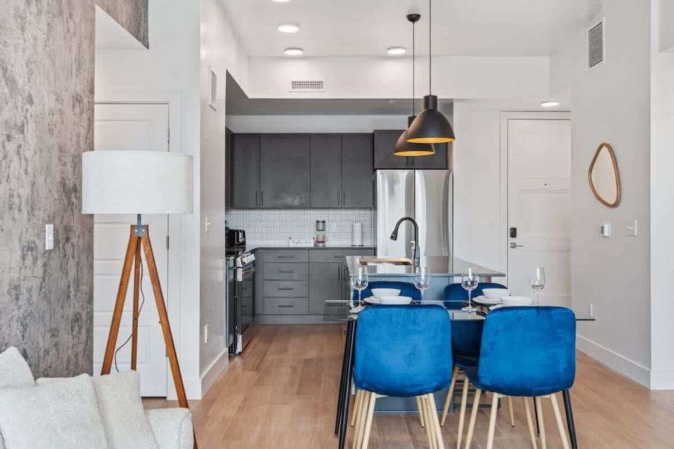 Dine in comfort at a chic four-person dining area just steps from the kitchen.