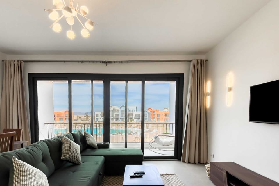 Basic Apartment | Living area | 55-inch Smart TV with cable channels