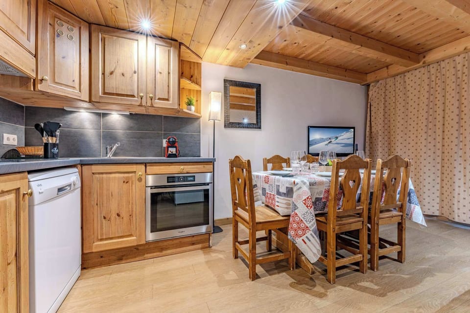 Gather around the wooden dining table for 6—perfect for family meals or fondue nights after skiing.
