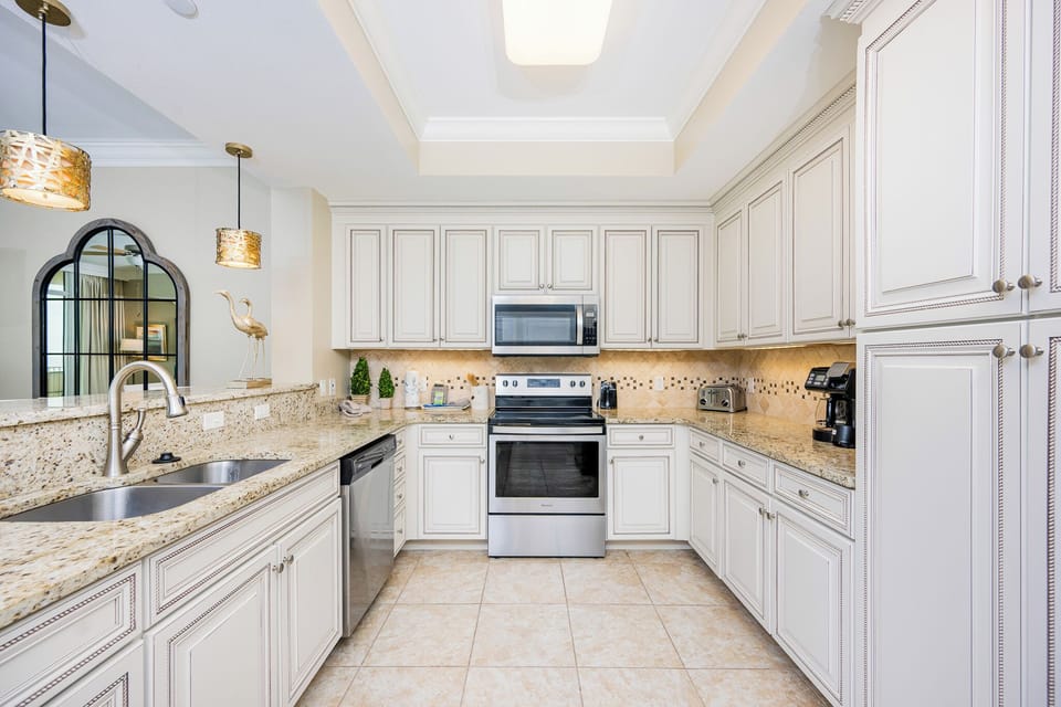 Create culinary delights in this stylish kitchen, featuring ample counter space and stainless appliances