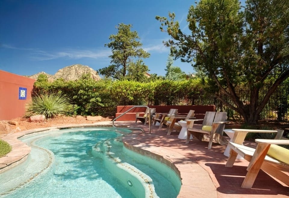 Soak in the serene heated pool with mountain views.