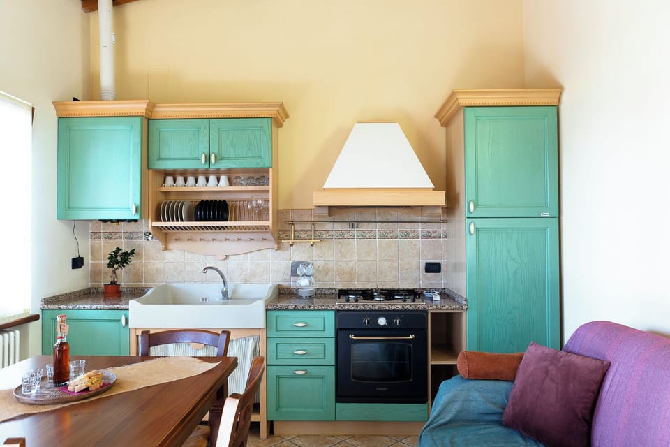 Panoramic Apartment, Patio, Lake View | Private kitchen | Full-size fridge, oven, stovetop, highchair