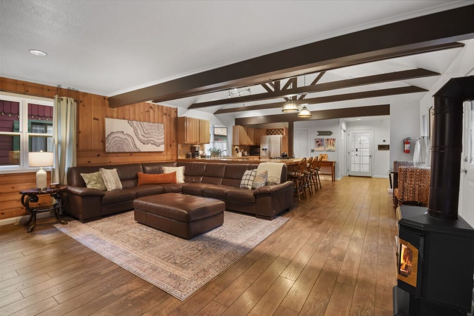 Open-concept layout that brings together the kitchen, dining, and living areas