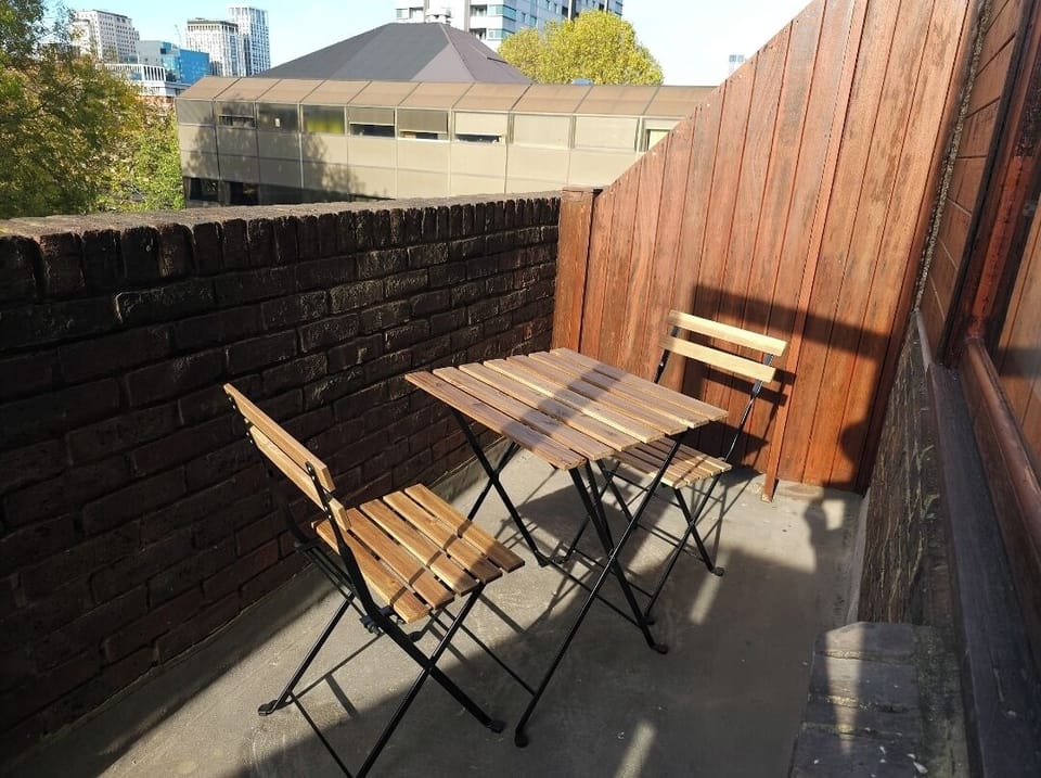 West facing balcony with table and chairs
