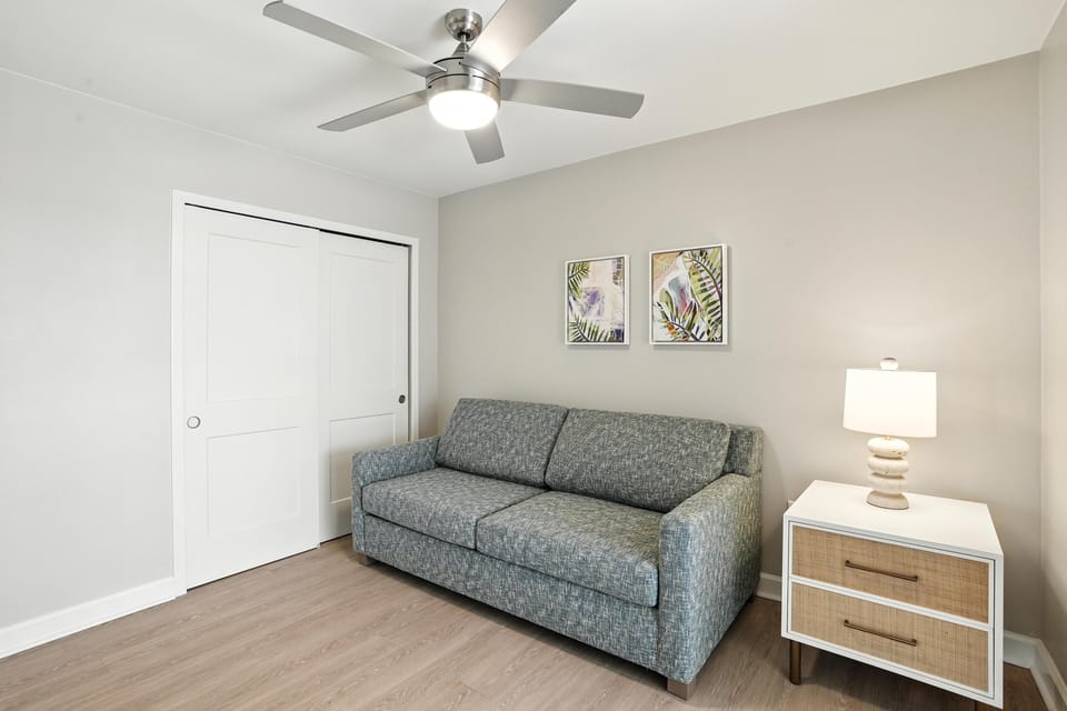 Deluxe Suite, 2 Bedrooms | Living area | 55-inch flat-screen TV with cable channels