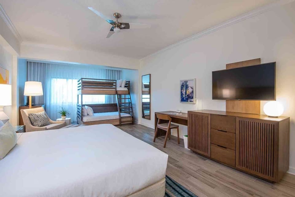 Share easy mornings and restful nights in a room that balances laid-back elegance with space for everyone.