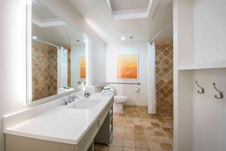 Step into a serene retreat where clean lines and natural textures create a soothing start or end to the day.