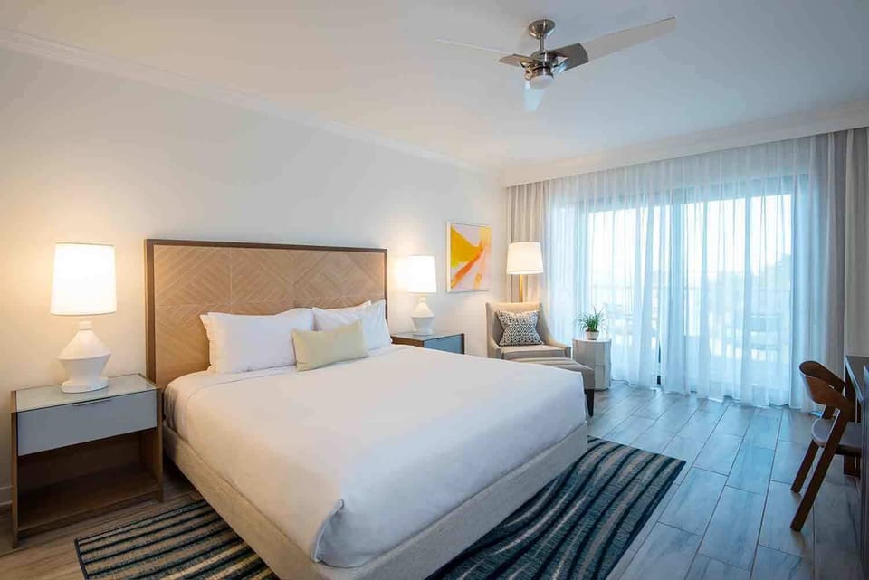 Wake to golden morning light filtering through sheer curtains, perfect for slow starts and ocean daydreams.