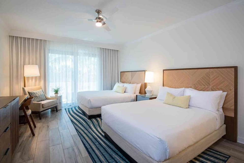 Settle in for a restful stay where breezy linens, natural wood tones, and soft light create effortless island comfort.