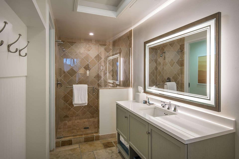 Treat yourself to a serene refresh in a bright space where natural tones and clean design offer effortless relaxation.