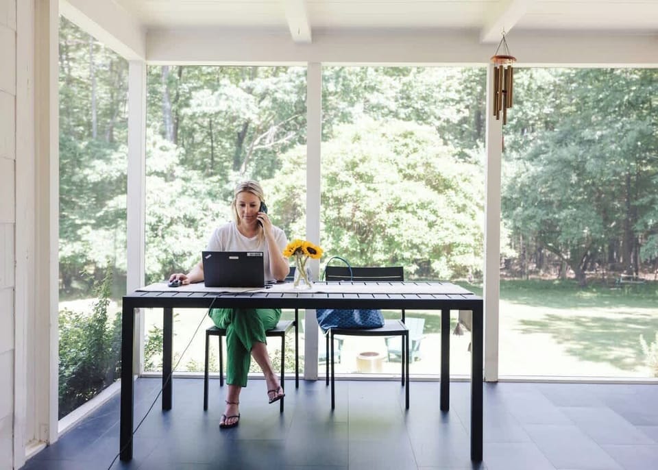 The screen in back porch is an amazing spot to work from home or just have a nice meal!