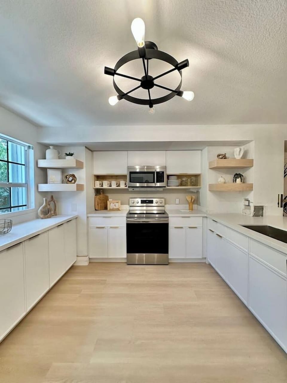 Modern kitchen with stainless steel appliances and all the space you need to cook or just hang out.