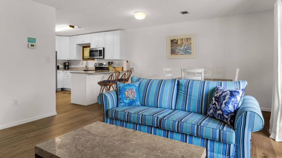 Condo, 1 Queen Bed with Sofa bed, Balcony, Garden View (Beachwood Villas 1C) | Living area | 42-inch flat-screen TV with digital channels