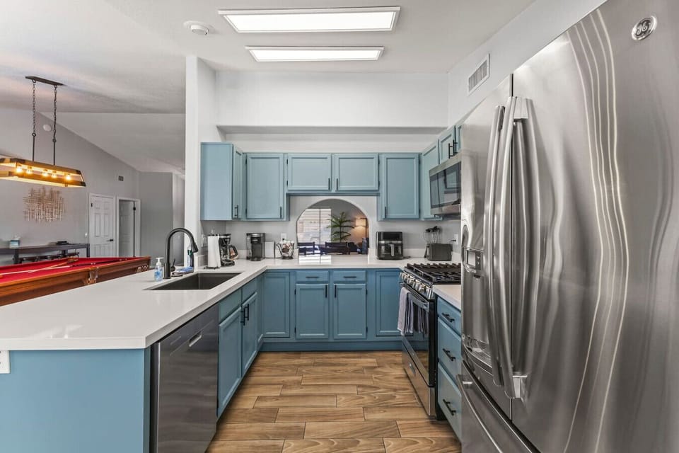 Full size and spacious kitchen with open layout to living area and back patio.