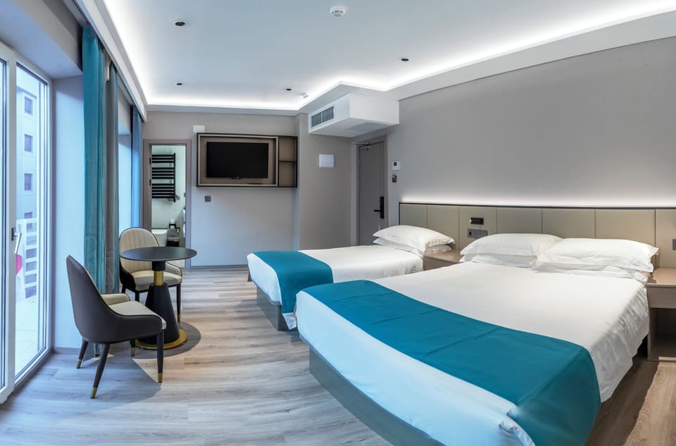 Family Triple Room | Premium bedding, down comforters, memory foam beds, in-room safe