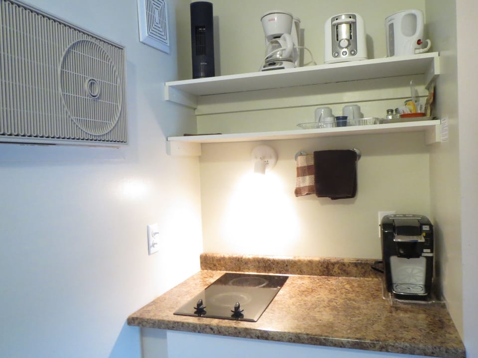 Coffee/tea maker, fridge, microwave, cookware/dishes/utensils