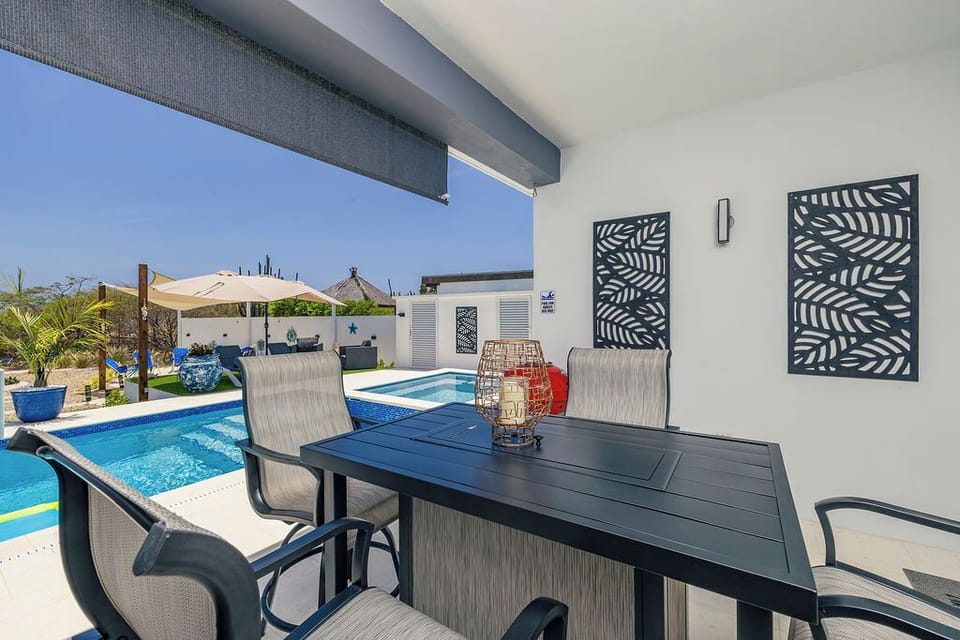 Savor al fresco dining on our enchanting patio, complete with a grill for mouthwatering BBQs and a cozy setup for unforgettable meals under the stars.