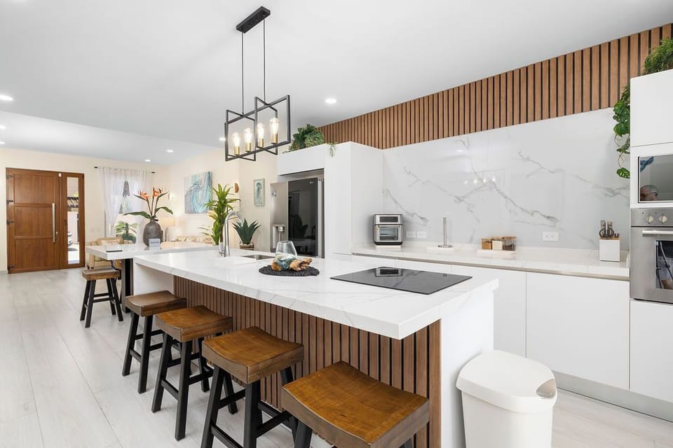 Gather around our spacious island counter—a perfect blend of style and functionality. Whether you’re savoring your morning coffee, sharing laughter over meals, or creating culinary delights together, this inviting space is where memories are made.