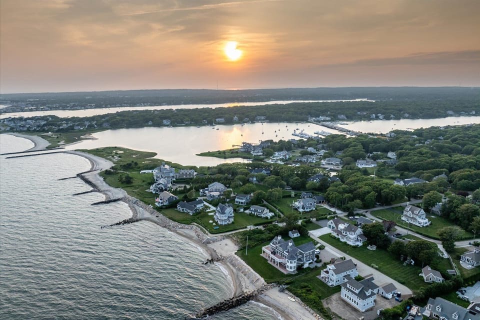 Aerial view of the neighborhood’s private coastline – enjoy direct access to serene beaches and scenic waterfront walks.