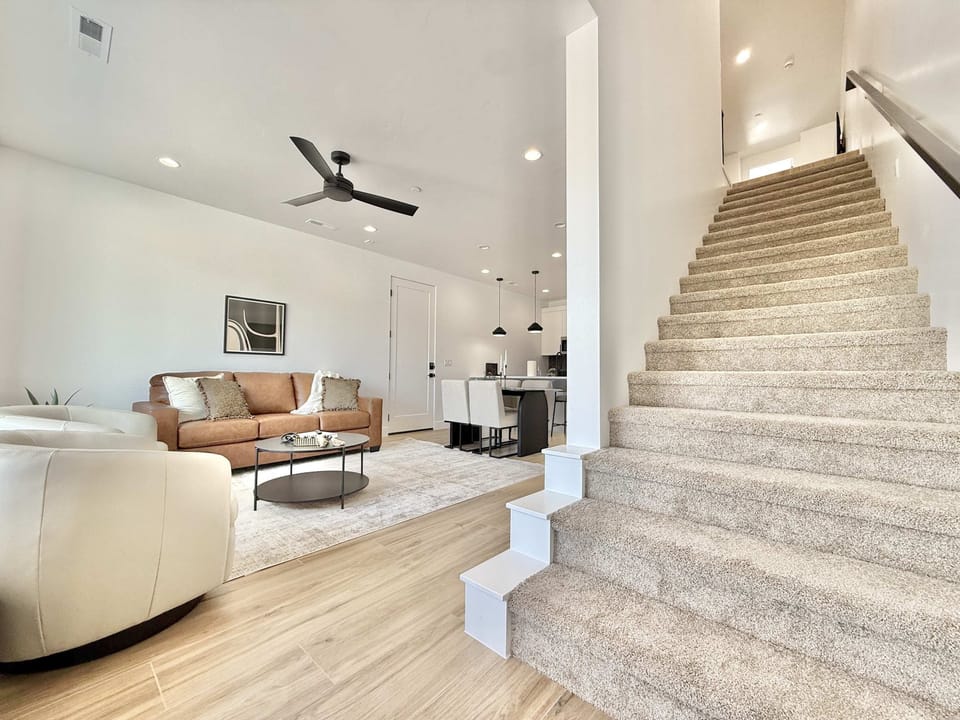 Head upstairs where you will find an additional living lounge area, 2 bedrooms, 2 bathrooms, and a second laundry room with full capacity machines
