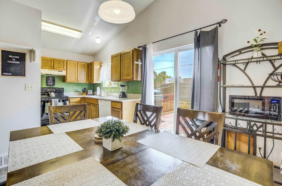 Dining area with seating for six, just off the fully equipped kitchen and steps from the backyard deck.