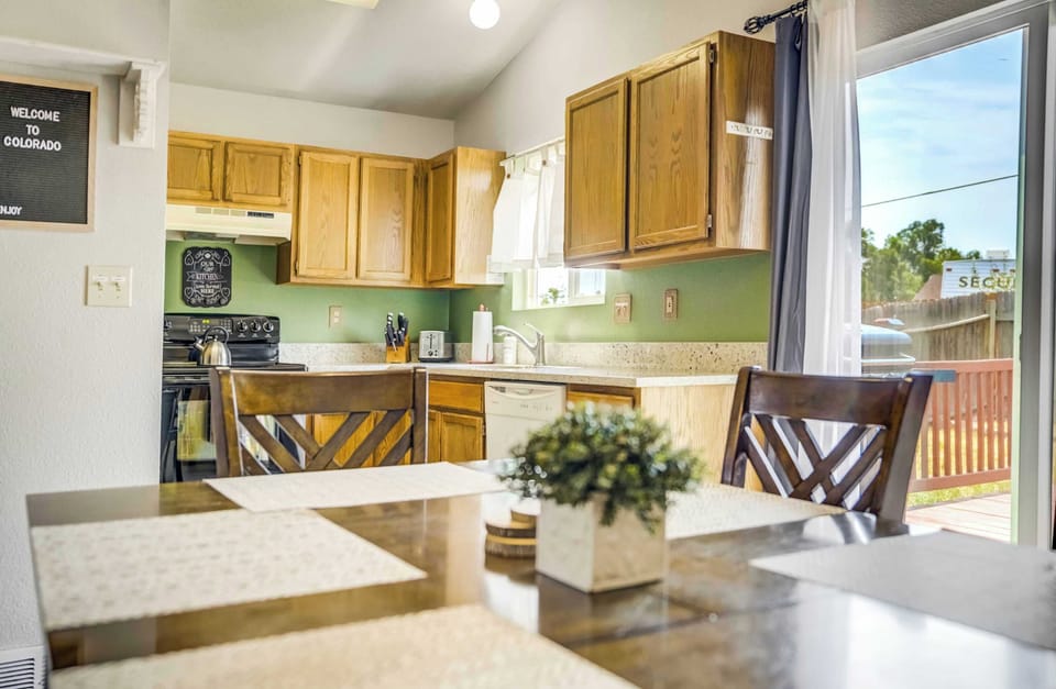 Dining area with seating for six, just off the fully equipped kitchen and steps from the backyard deck.