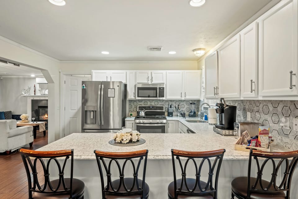 Barstool seating at the kitchen counter for casual dining and easy conversation.