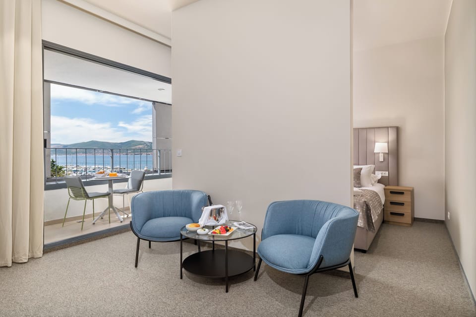 Deluxe Double or Twin Room, Balcony, Sea View | Minibar, in-room safe, desk, blackout drapes