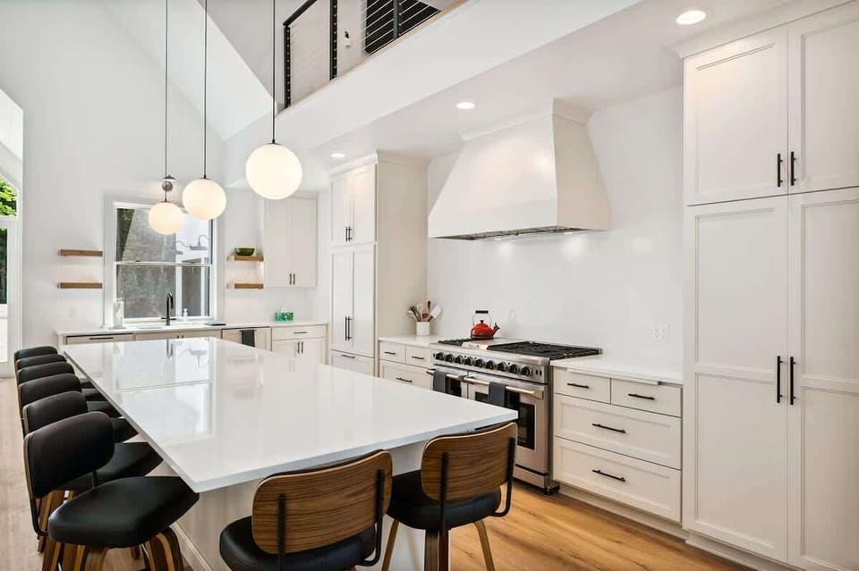 Sleek, spacious, and ready to host your crew. The fully equipped kitchen at Point Beach features high-end appliances, clean Scandinavian design, and plenty of room for cooking, gathering, and making memories