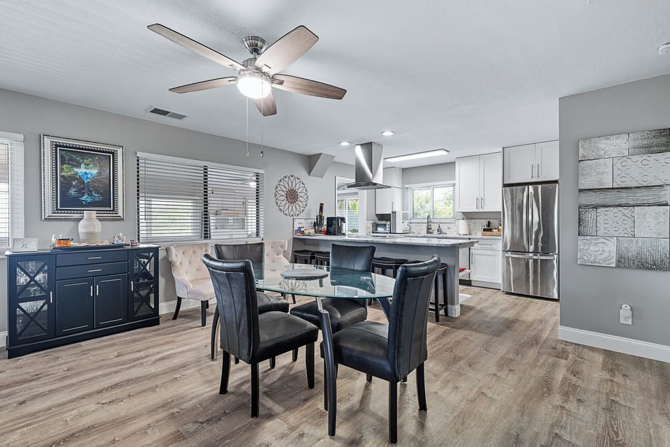 Dining table overlooking the open platform modern kitchen, 2nd floor of home
