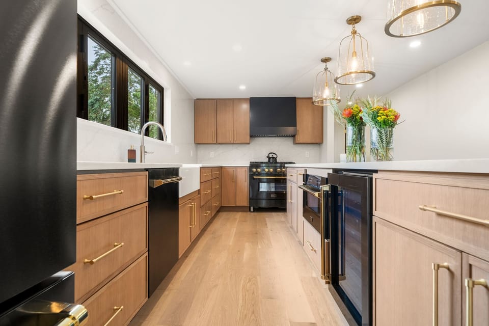 Clean lines, warm wood, and a farmhouse sink. Cooking here is actually fun.