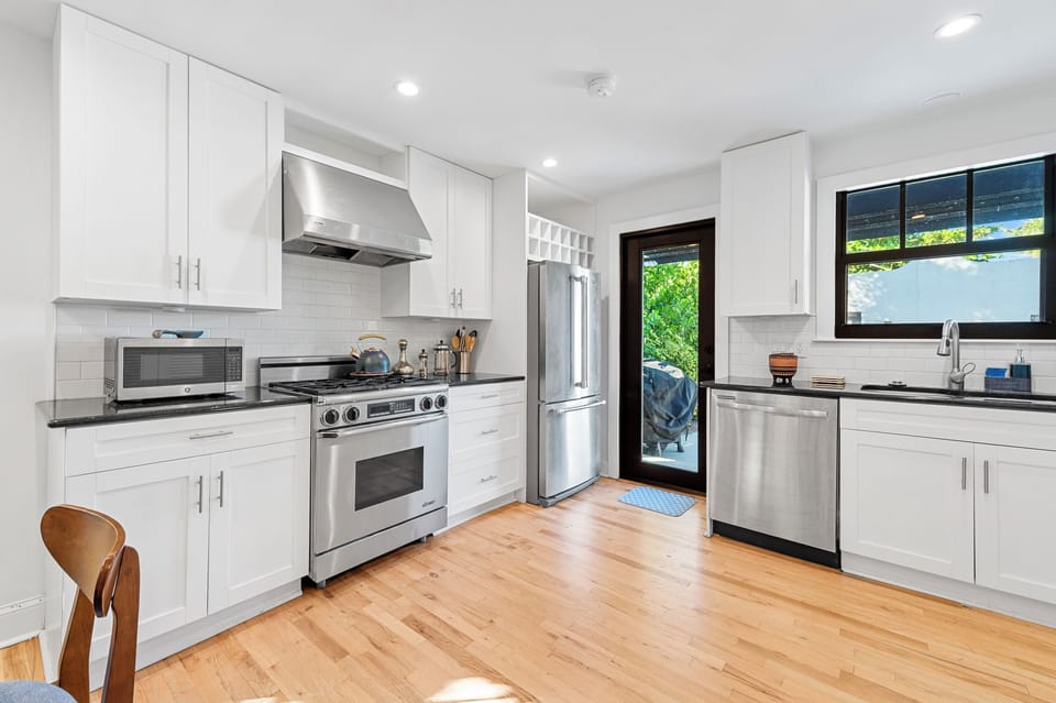 Chef's Kitchen: Whip up culinary delights in this sleek, modern space with vibrant natural light!