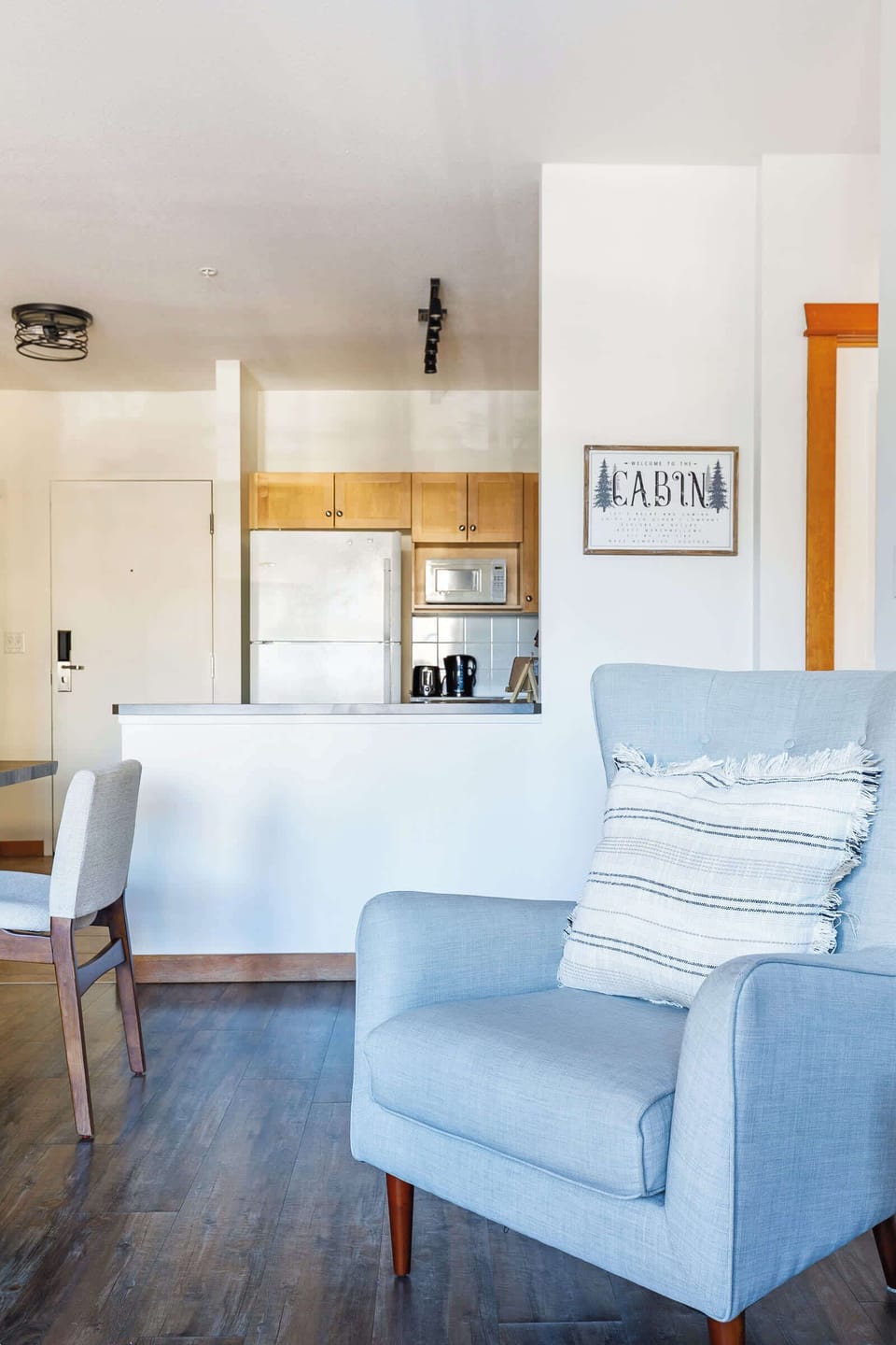 Comfortable seating in an open layout connecting living, dining, and kitchen.
