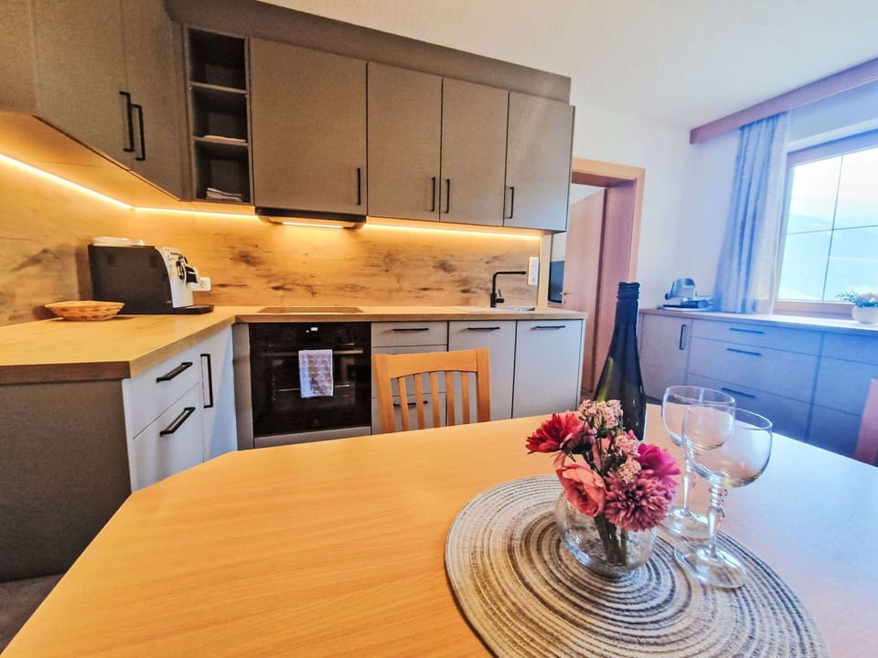 Flooring, Interior Design, Wood, Countertop, Kitchen, Furniture, Floor, Cabinetry, Kitchen Appliance, Lighting