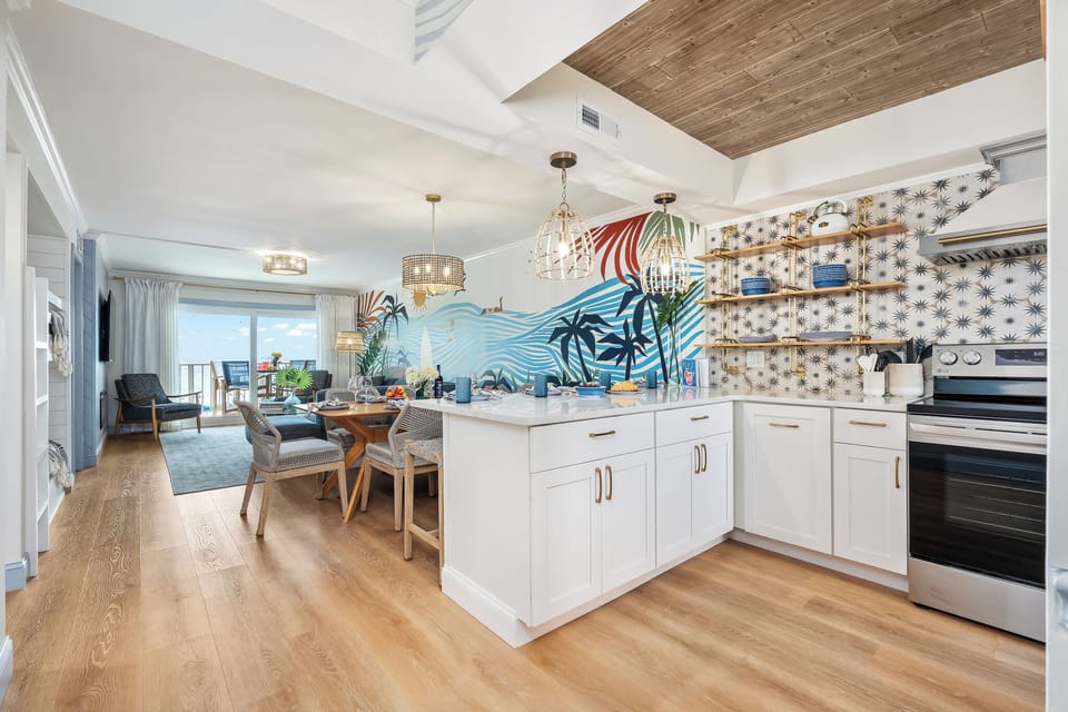 The open kitchen flows right into the living room so you never miss the conversation.
