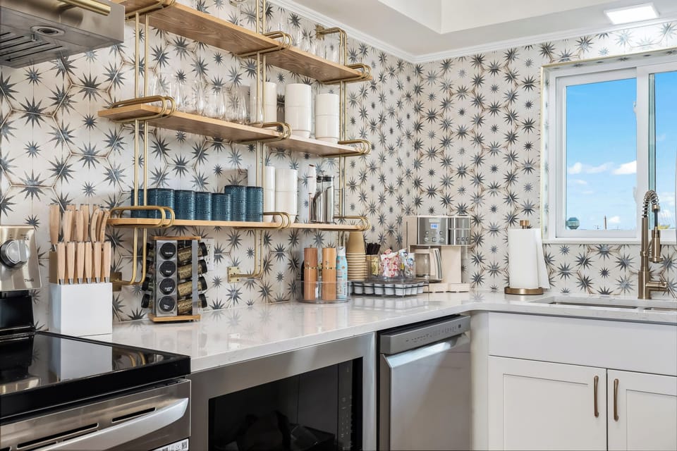 Open shelving means everything you need is visible and within reach -- this kitchen is fully loaded.
