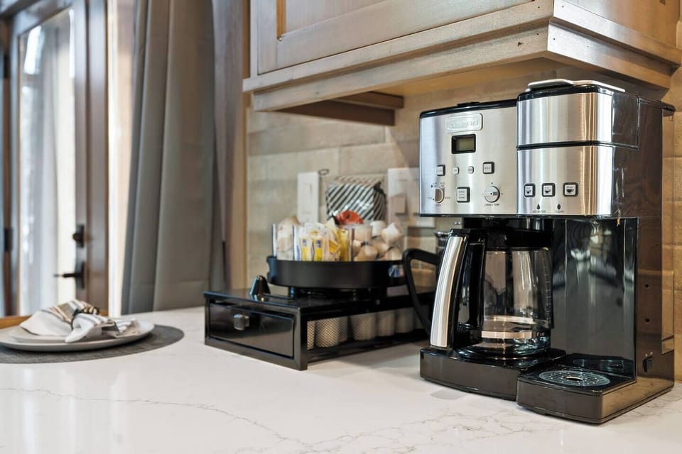 Coffee Bar with Cuisinart ground & Kcup combo maker. Ground coffee, Kcups, creamers and sugars. French Press and Frother as well!