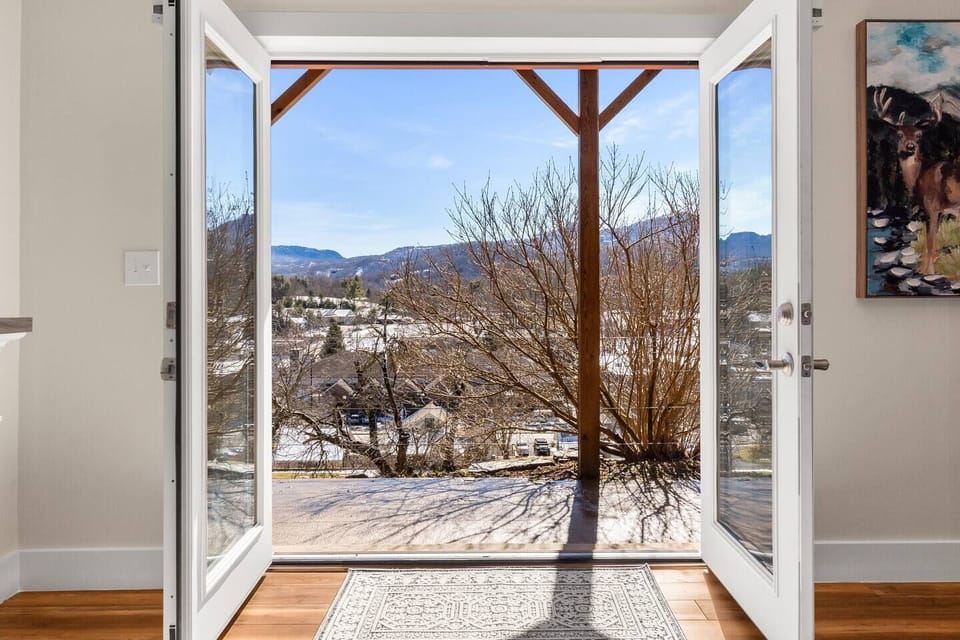 Master bedroom on the lower level. View out the French doors