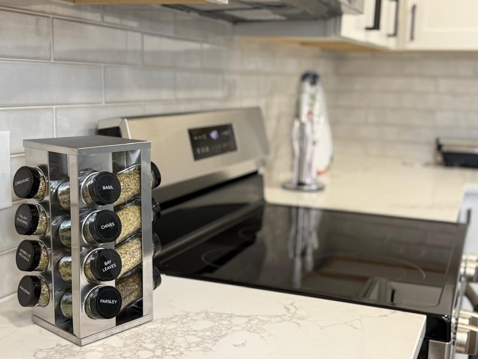 Fully equipped kitchen with oven & fridge can cook and store meals 