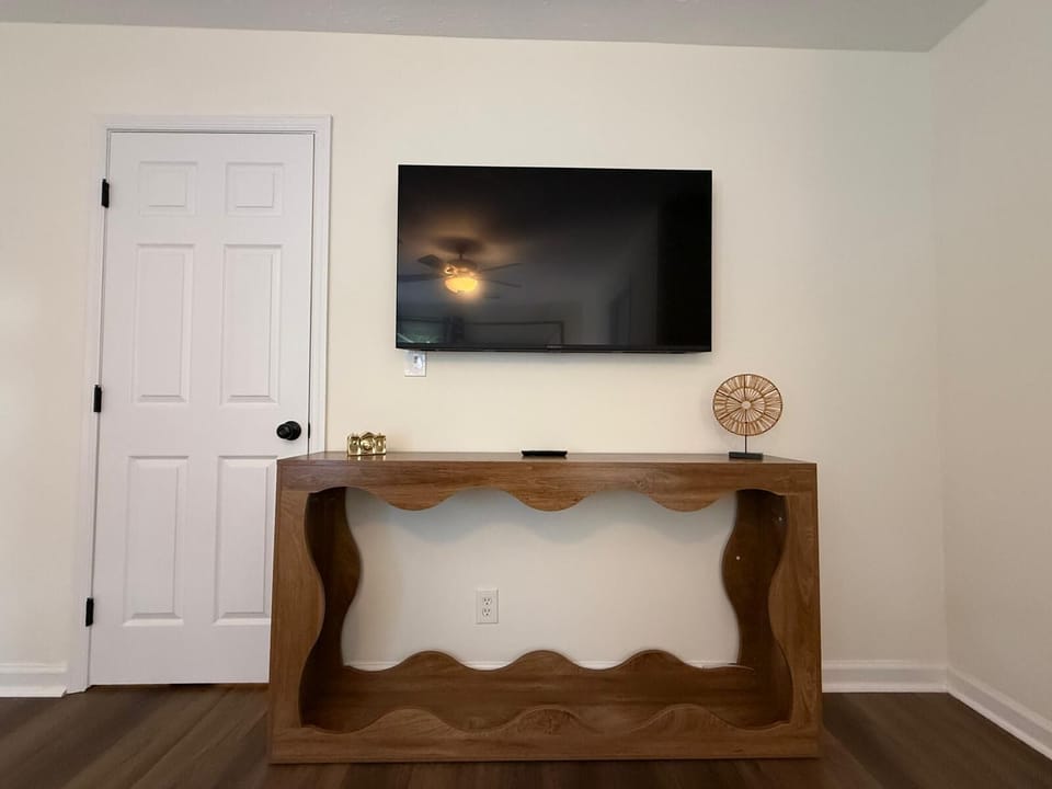 Spacious living room with TV, perfect for relaxing and movie nights