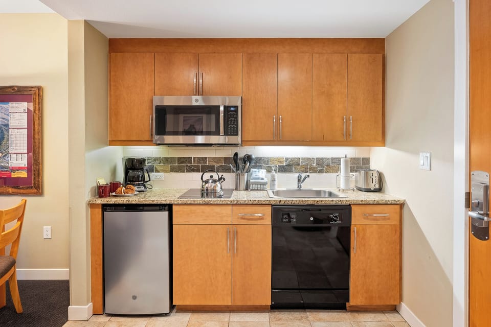 - Fully equipped kitchen with granite countertops, microwave, and full size appliances - Plenty of cabinetry and sleek backsplash make cooking easy and enjoyable - Everything you need to prep meals, snacks, or a quiet night in with wine